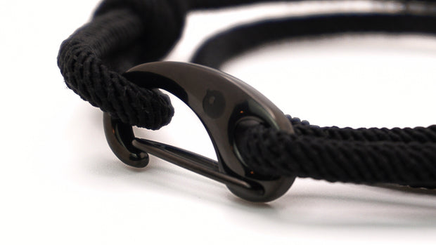 Close-up of a black milan rope bracelet with a black pvd stainless steel clasp