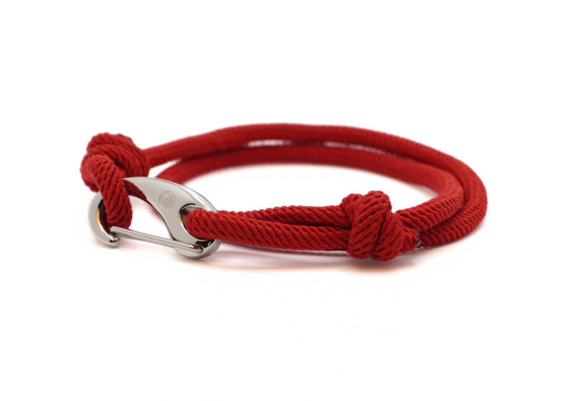 Red braided bracelet with a silver stainless steel clasp