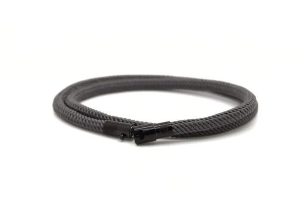Grey braided cord with a pvd coated stainless steel clasp